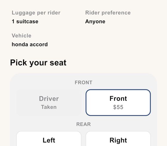 Seat picker showing front and rear seats with the driver seat marked as taken